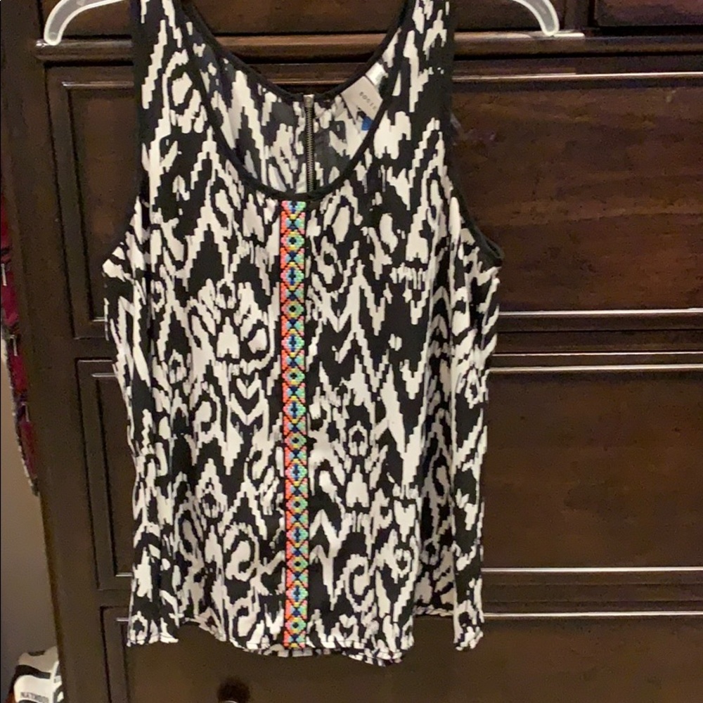 Black and white sleeveless blouse